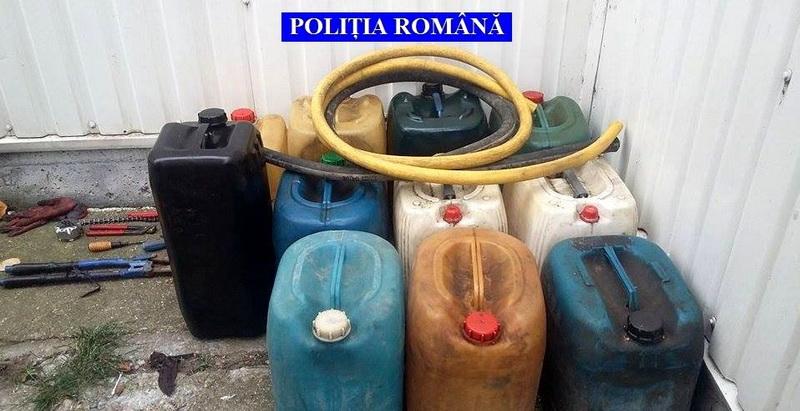 Doi bărbaţi prinşi la furat motorină dintr-o locomotivă